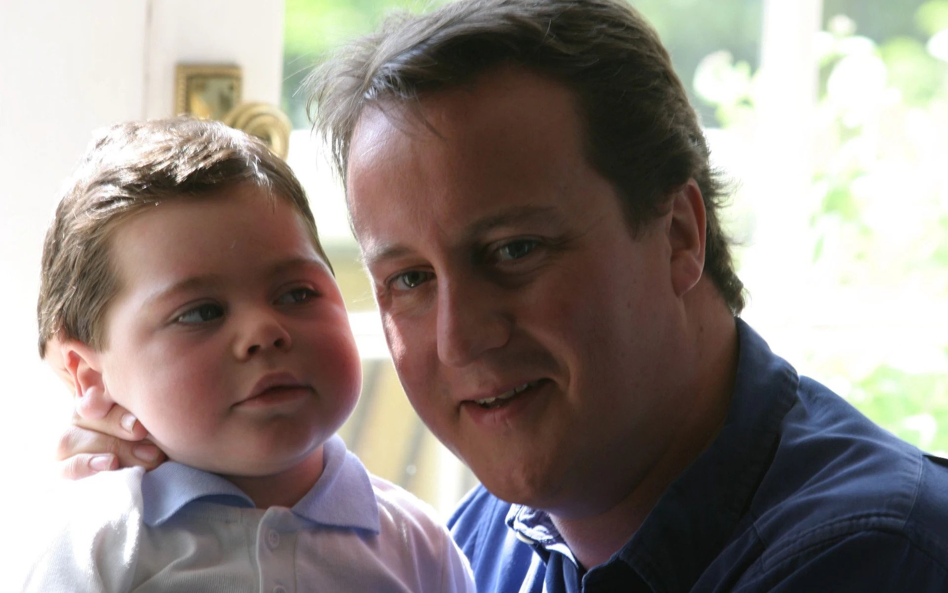 David Cameron with son Ivan, who died aged six from a rare neurological condition Credit: Roger Taylor