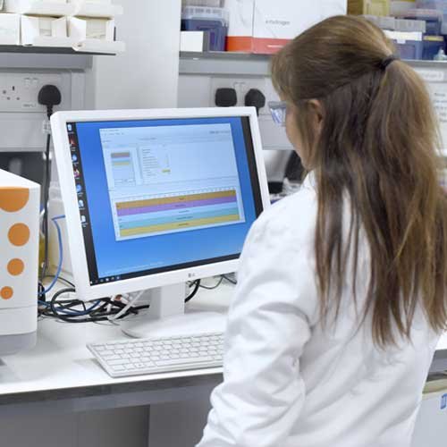 A scientist viewing a computer monitor